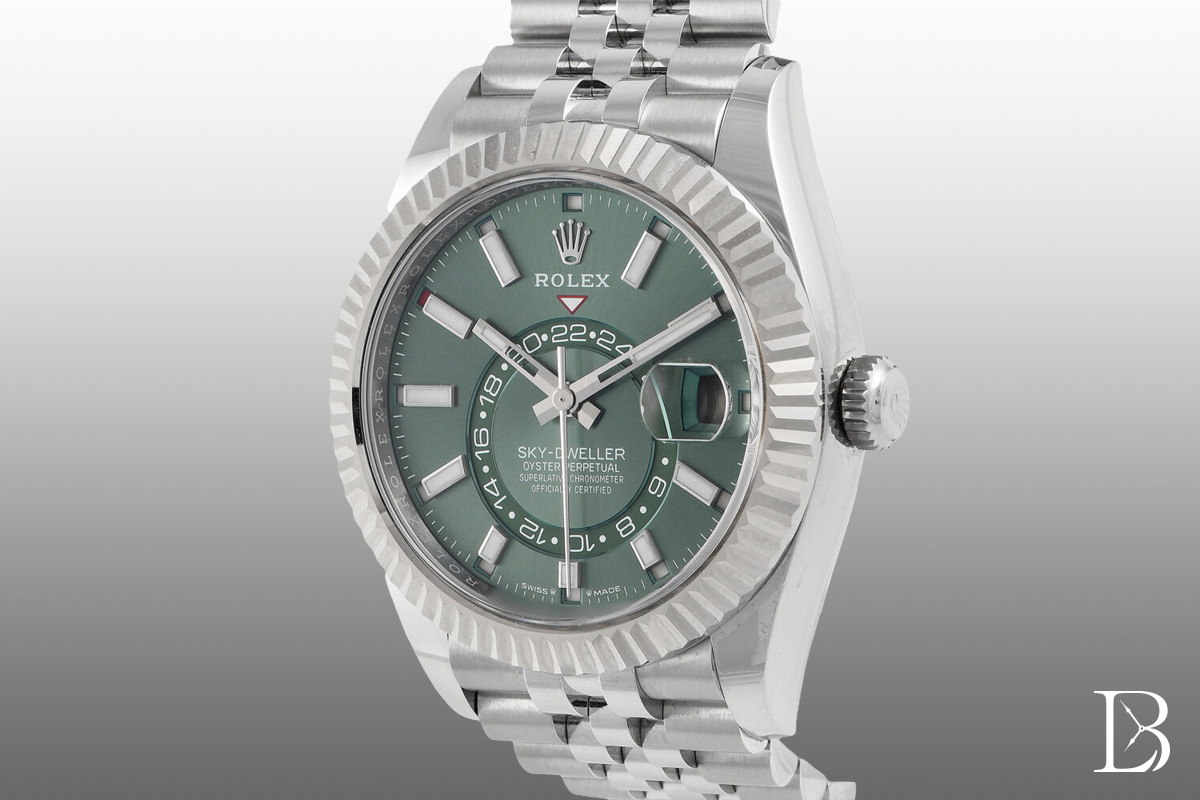 The generation of Sky-Dwellers released in 2023 has two crowns between "Swiss" and "Made," and a mint green dial option.
